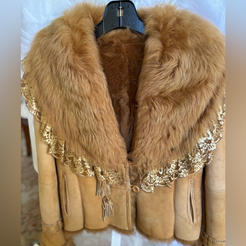 Vintage lamb shearling with tan/camel suede accented with distinctive gold lace.